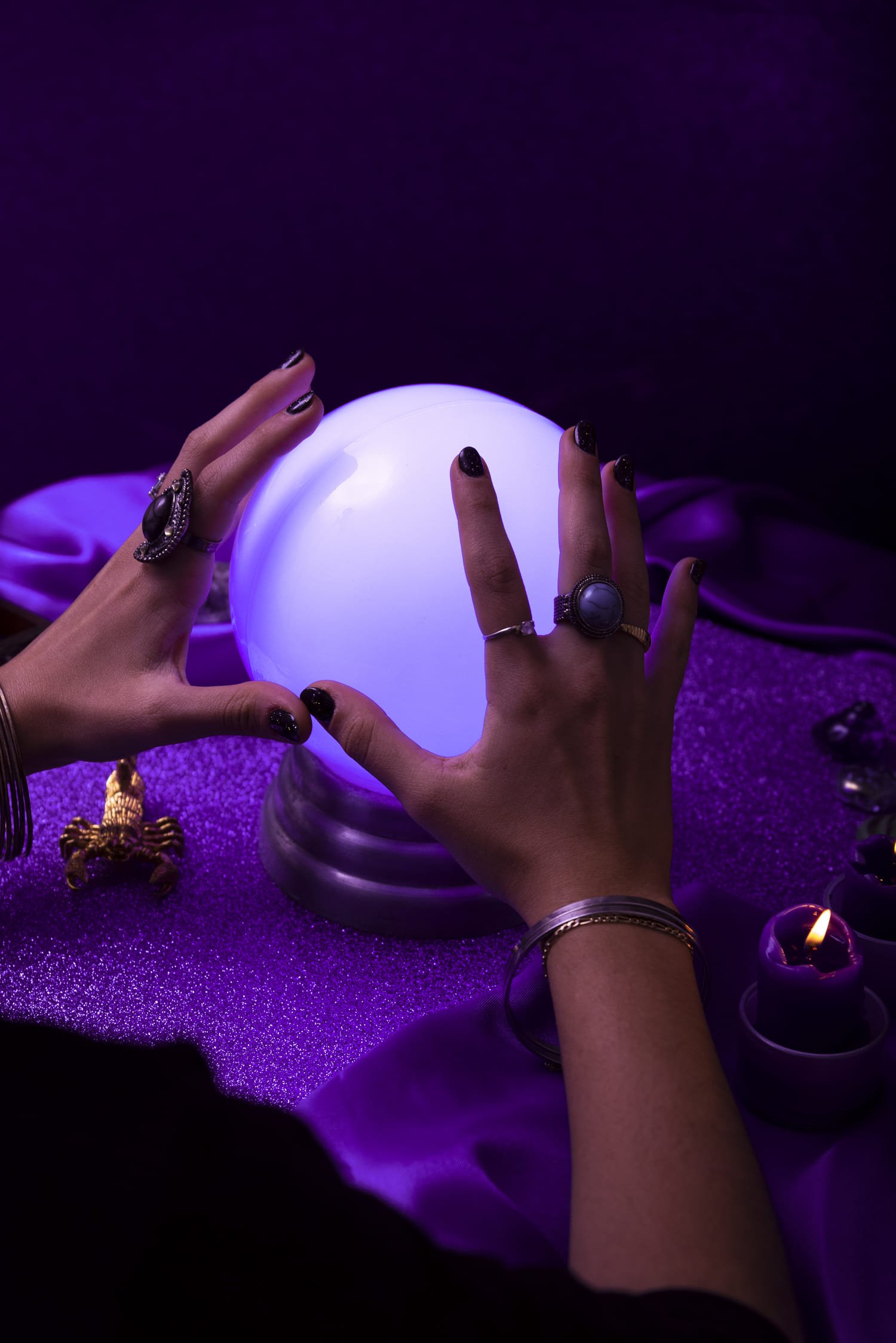 high-angle-hands-holding-crystal-ball (1)